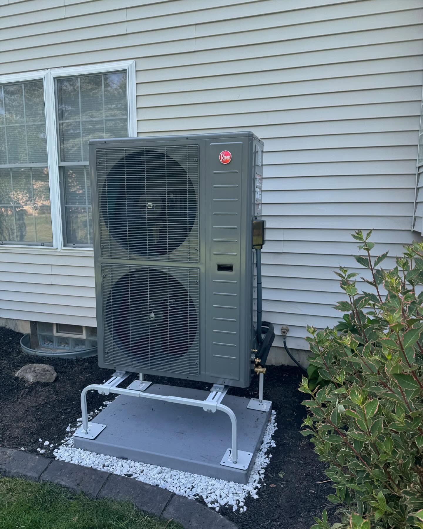 Outdoor cold-climate heat pump installation