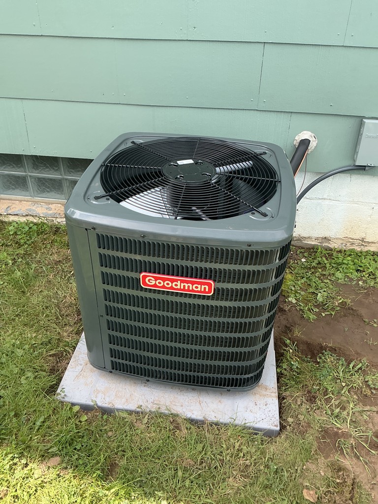 Goodman outdoor AC condenser installation in Rochester, NY